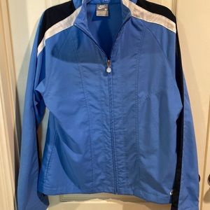 Nike Blue Windbreaker Size Medium. With pockets and no liner.